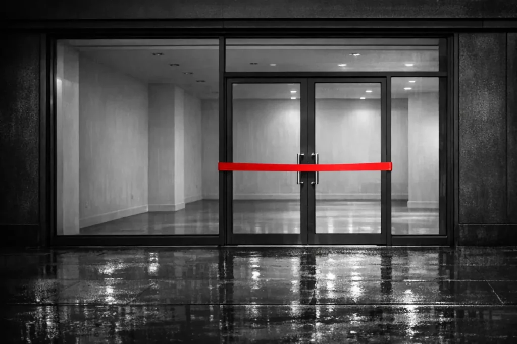 New betting sites: an empty new shop unit with a red ribbon across its glass doors